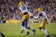 LSU linebacker K'Lavon Chaisson (18) stops Florida quarterback Kyle Trask on a fourth down near the goal line late in the second half of an NCAA college football game in Baton Rouge, La., Saturday, Oct. 12, 2019. LSU won 42-28. (AP Photo/Gerald Herbert)