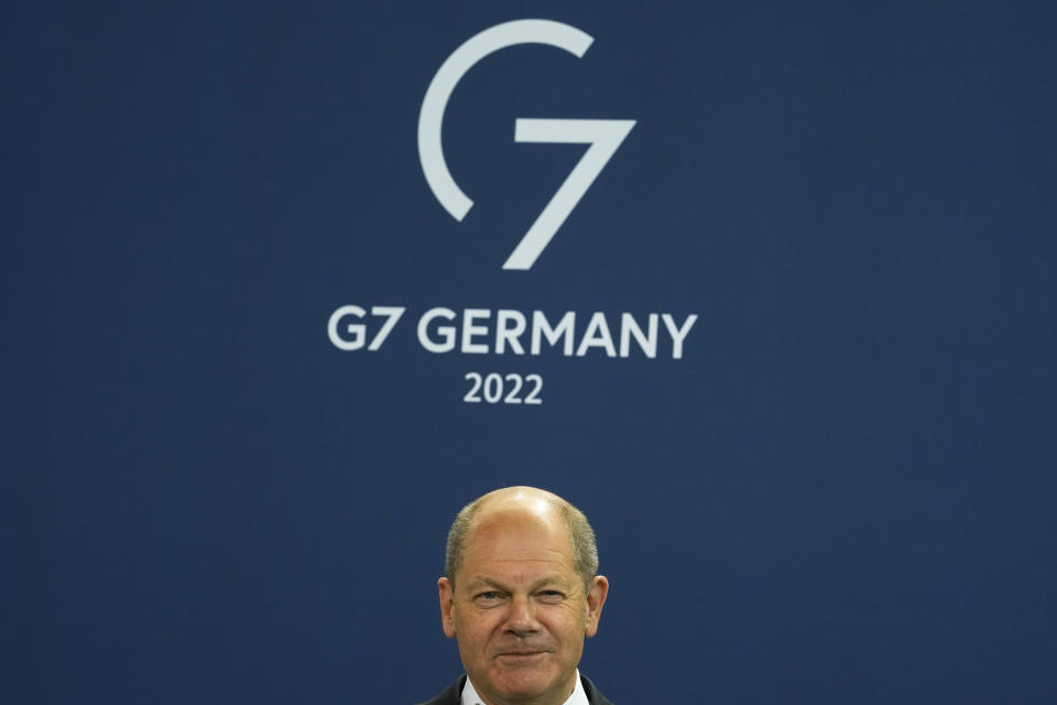 FILE - German Chancellor Olaf Scholz attends the presentation of a special stamp of the German mail service Deutsche Post for the upcoming G-7 summit, at the chancellery in Berlin, Germany, June 15, 2022. At this year's G-7 summit, Germany will push its plan for countries to join together in a ‘climate club' to tackle global warming. Members of the club would agree on ambitious emissions targets and exempt each other from climate-related trade tariffs. (AP Photo/Markus Schreiber, File)