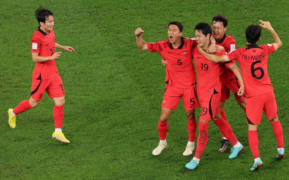 South Korea's defender #19 Kim Young-gwon celebrates scoring his team's first goal - AFP