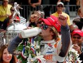 Dan Wheldon celebrates in victory lane after winning the Indianapolis 500 in May 2011. Wheldon was killed in a massive crash at the Las Vegas 300 IndyCar series finale on Sunday