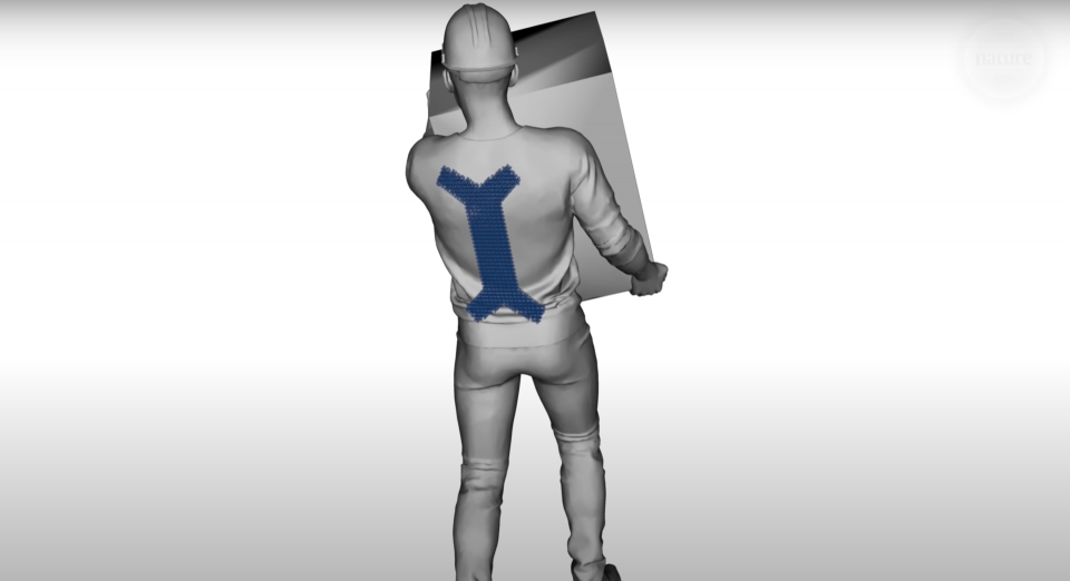 A digital illustration of a worker carrying a box, aided by a small, chain mail exoskeleton on his back.