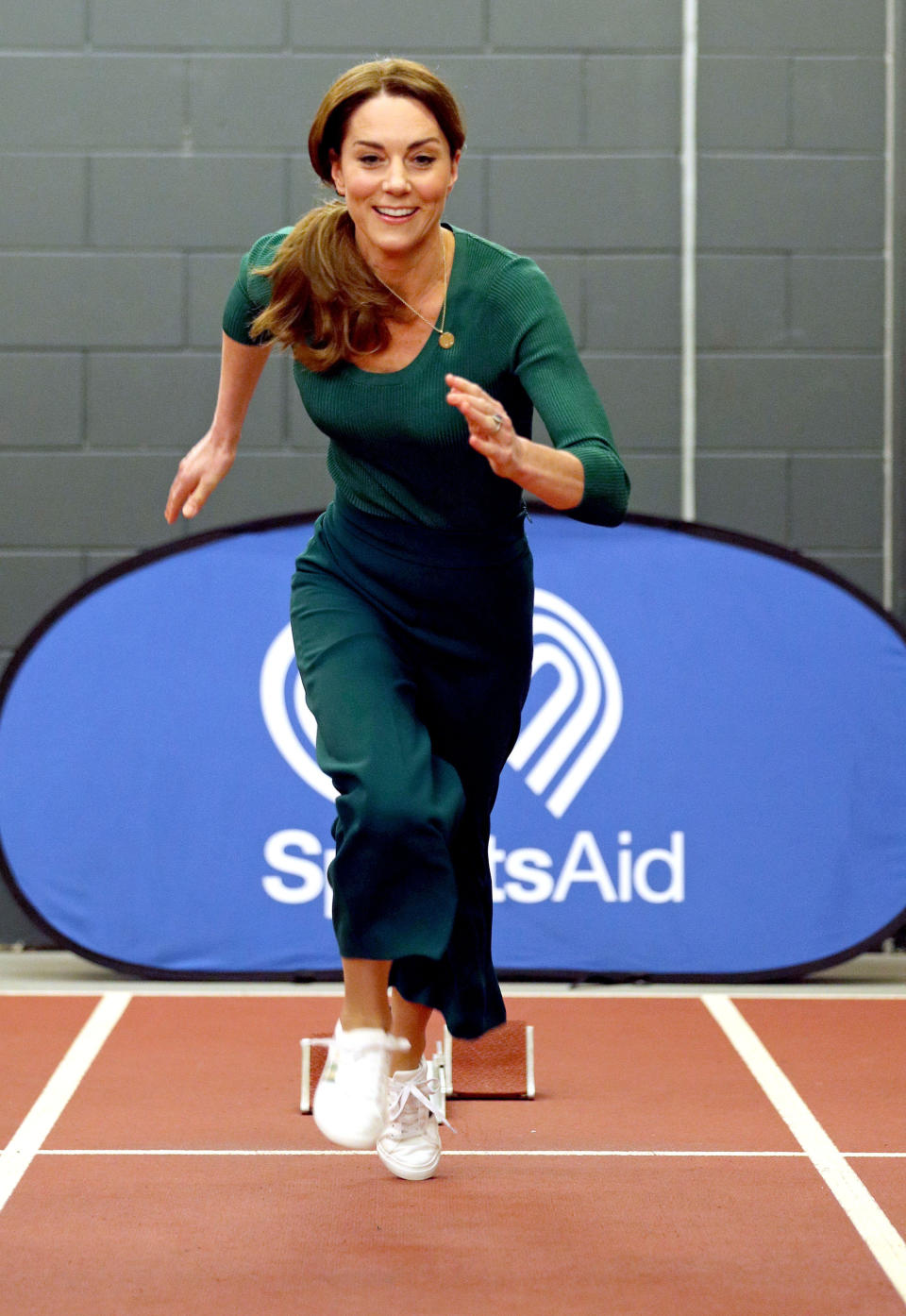 Britain's Catherine, Duchess of Cambridge, tries out the running track with starting blocks during a SportsAid event at the London Stadium in east London on February 26, 2020. (Photo by Yui Mok / POOL / AFP) (Photo by YUI MOK/POOL/AFP via Getty Images)