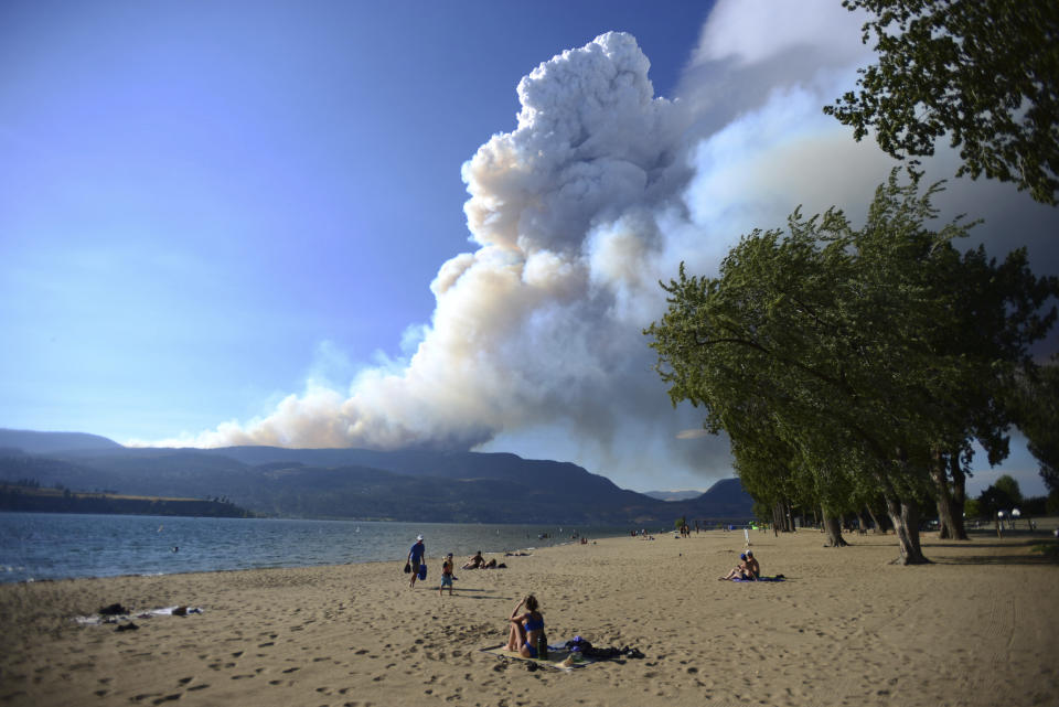 Smoke from the McDougall Creek fire is seen over Okanagan Lake from Kelowna, British Columbia, on Thursday, Aug. 17, 2023. (Joe O'Connal/The Canadian Press via AP)