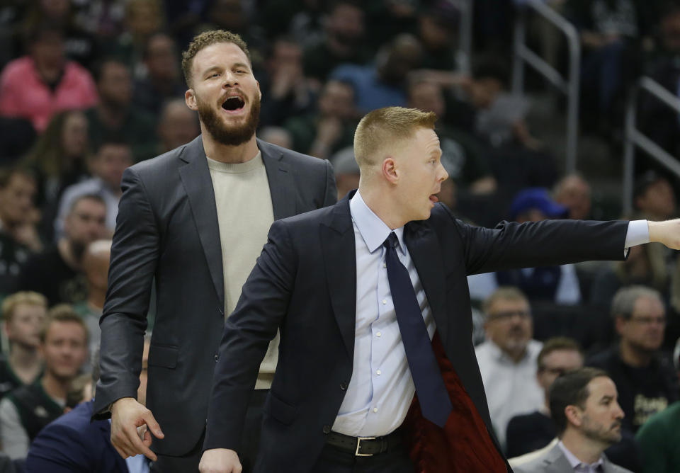 Detroit Pistons' Blake Griffin, left, reacts from the bench during the first half of Game 2 of the team's NBA basketball first-round playoff series against the Milwaukee Bucks on Wednesday, April 17, 2019, in Milwaukee. (AP Photo/Aaron Gash)