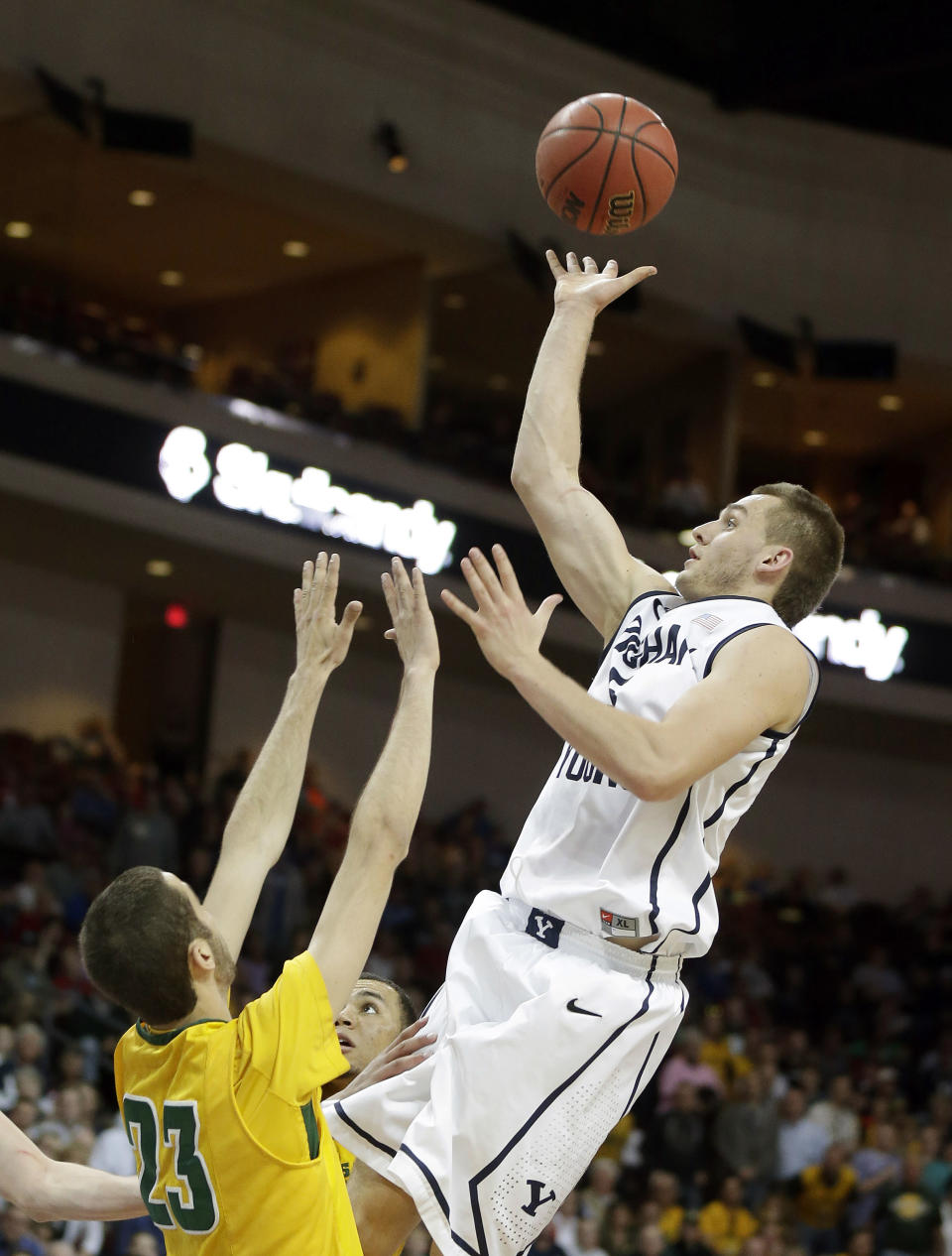 San Francisco's Mark Tollefsen covers a shot from BYU's Kyle Collinsworth during the second half of a West Coast Conference tournament NCAA college basketball game Monday, March 10, 2014, in Las Vegas. BYU defeated San Francisco 79-77 in overtime. (AP Photo/Isaac Brekken)