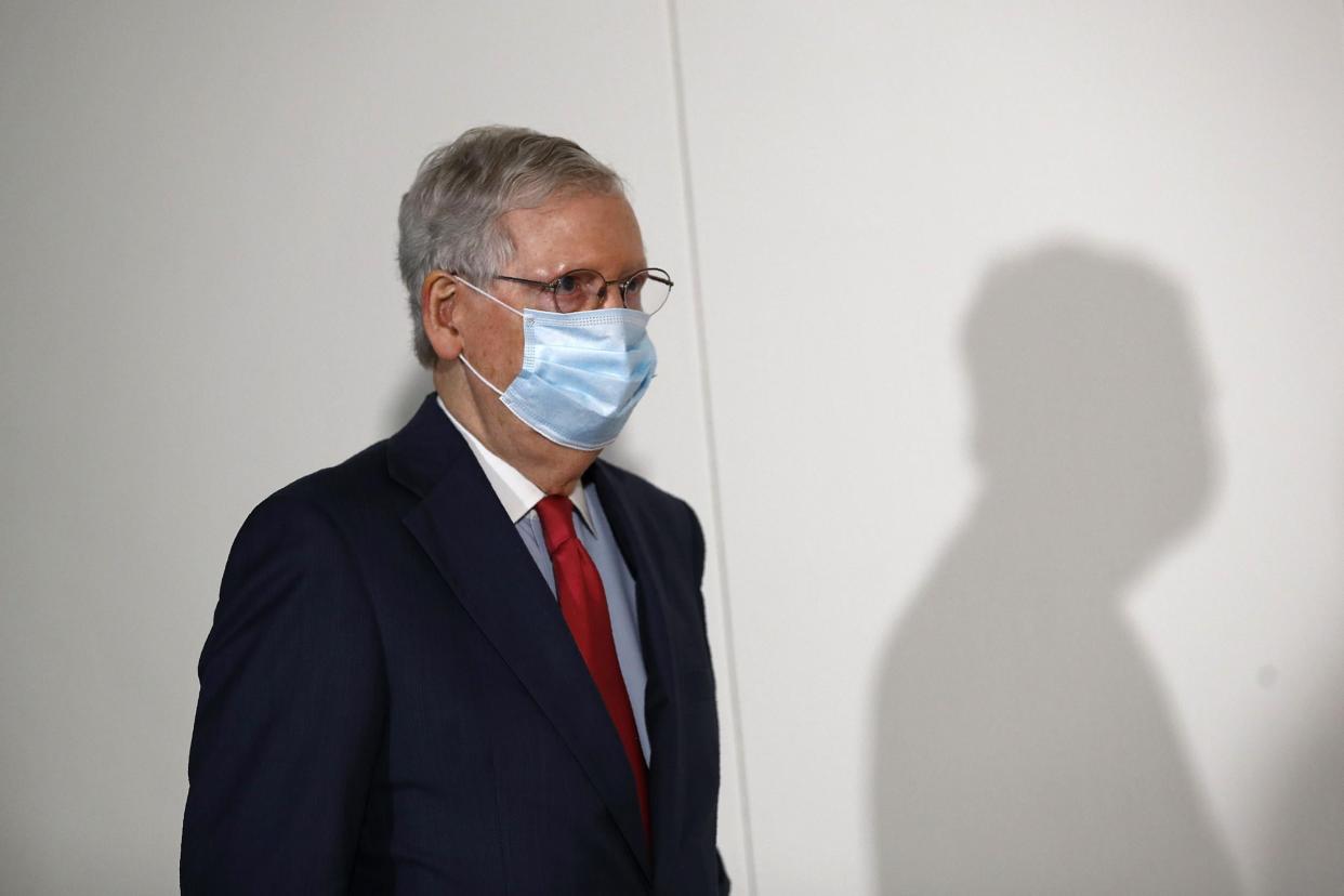 Senate Majority Leader Mitch McConnell wears a face mask used to protect against the spread of the new coronavirus as he attends a press conference after meeting with Senate Republicans on 19 May, 2020: AP Photo/Patrick Semansky