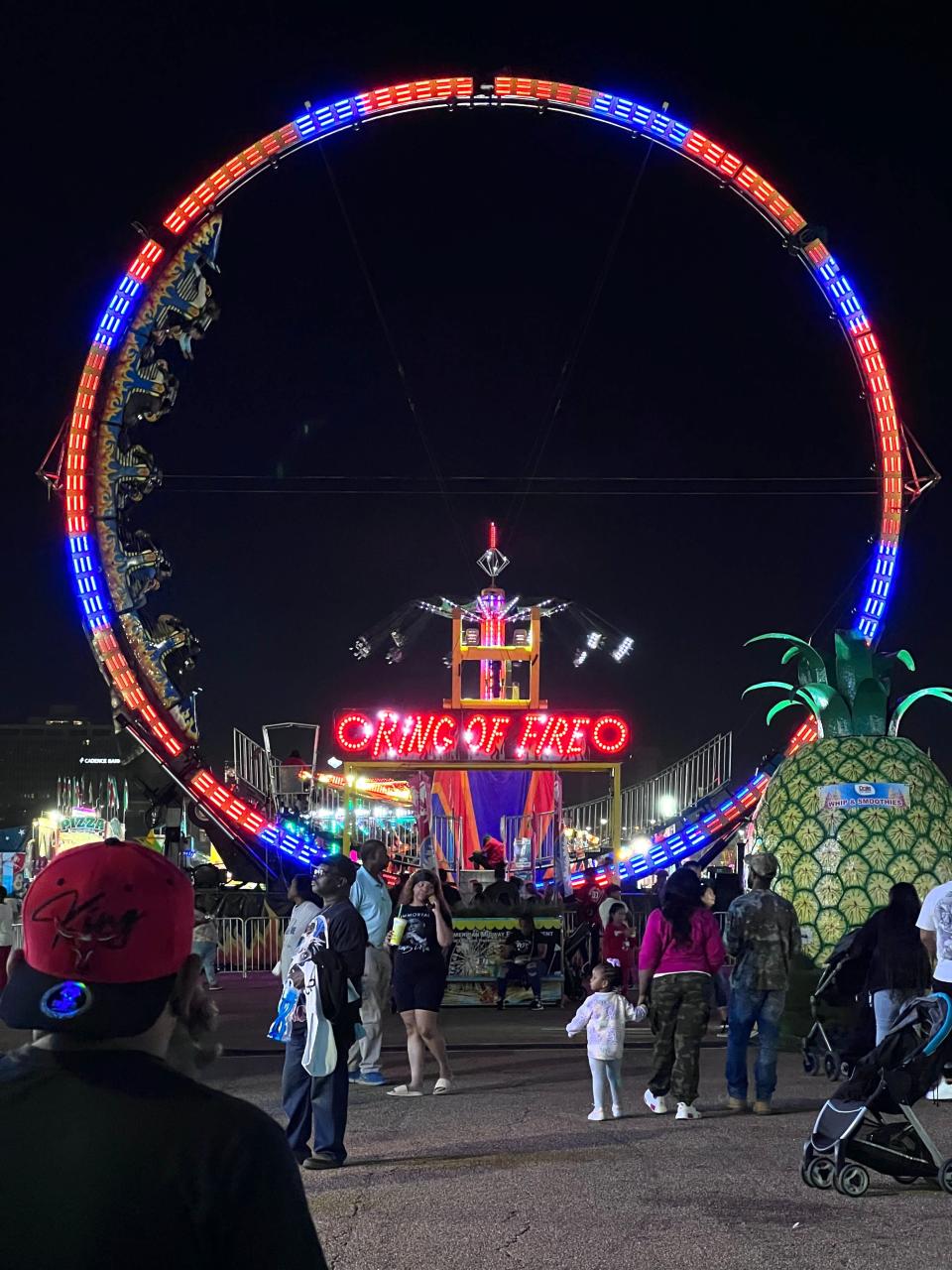 Visitors enjoy a night out at the 164th Mississippi State Fair underway at the Mississippi State Fairgrounds in downtown Jackson on Tuesday, October 10, 2023 in Jackson, MS.