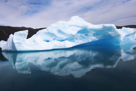 Calved icebergs from the nearby Twin Glaciers are seen floating on the water on July 30, 2013 in Qaqortoq, Greenland.