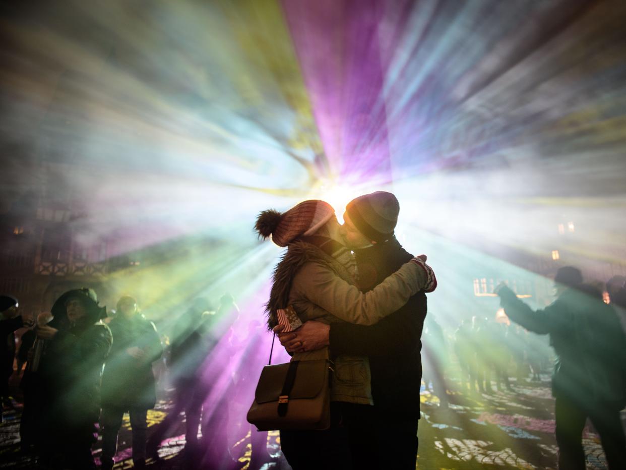 couple kissing at a festival