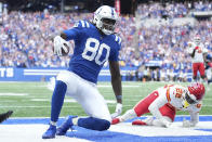 Indianapolis Colts tight end Jelani Woods (80) makes a touchdown reception against Kansas City Chiefs' Juan Thornhill during the second half of an NFL football game, Sunday, Sept. 25, 2022, in Indianapolis. (AP Photo/AJ Mast)