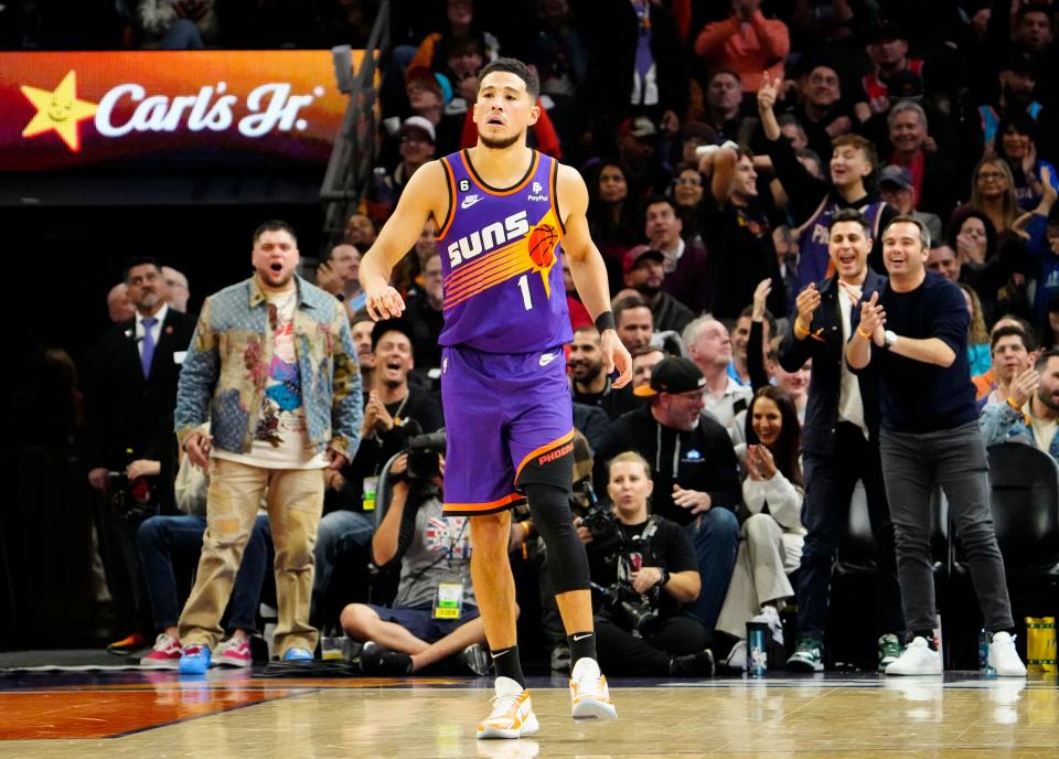 Nov 30, 2022; Phoenix, AZ, USA; Phoenix Suns guard Devin Booker (1) receives applauds from the fans after making a three-pointer against the Chicago Bulls in the second half at Footprint Center. Mandatory Credit: Rob Schumacher-Arizona Republic