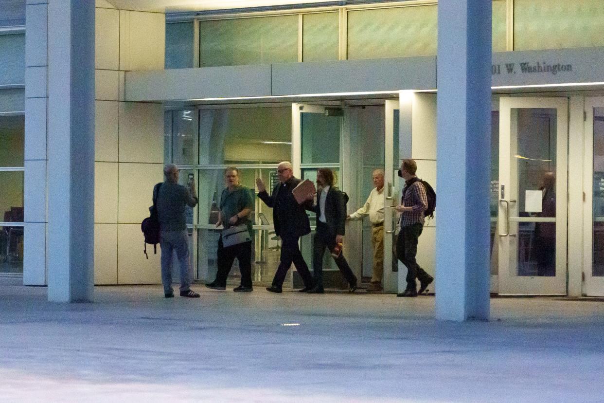 Former Backpage.com owner Michael Lacey waves off reporters as he exits the Sandra Day O'Connor United States Courthouse after a verdict is read on Nov. 16, 2023, in Phoenix.