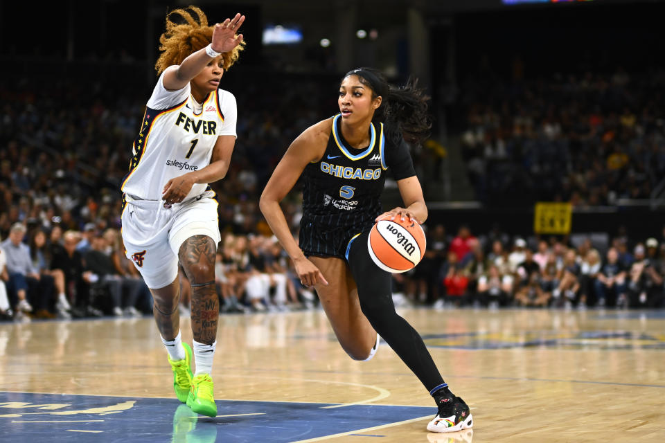 CHICAGO, ILLINOIS - JUNE 23: Angel Reese #5 of the Chicago Sky drives with the basketball in the first half against NaLyssa Smith #1 of the Indiana Fever at Wintrust Arena on June 23, 2024 in Chicago, Illinois.  NOTE TO USER: User expressly acknowledges and agrees that, by downloading and or using this photograph, User is consenting to the terms and conditions of the Getty Images License Agreement. (Photo by Quinn Harris/Getty Images)