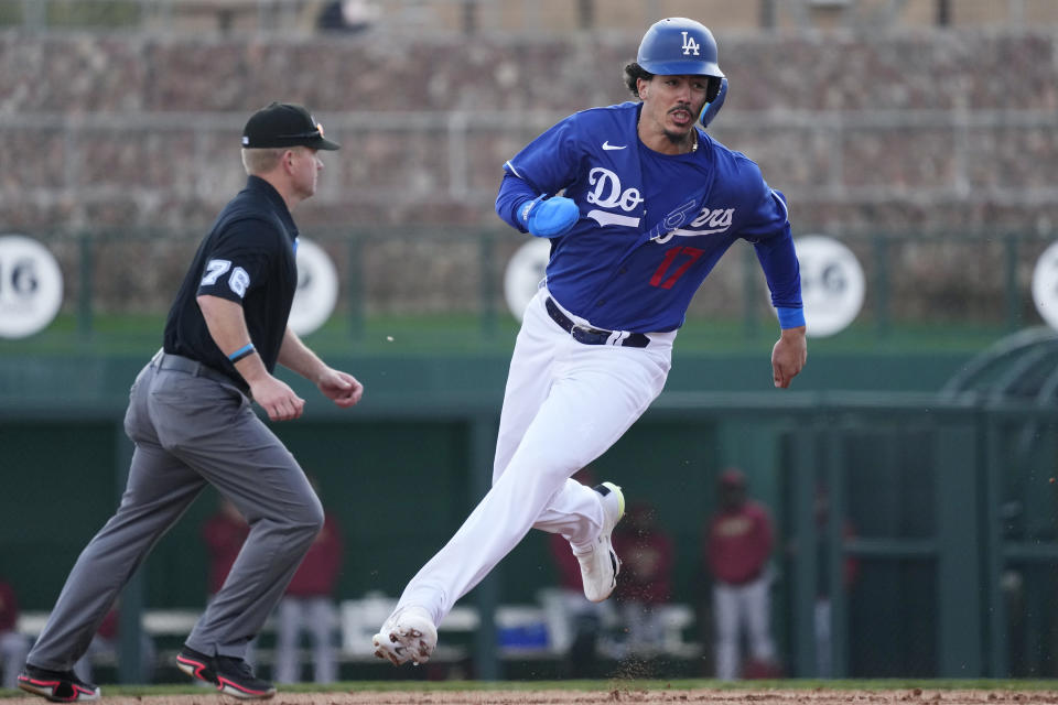 Dodgers rookie Miguel Vargas runs the bases in spring training in early March. How'd he reach those bases? By walking even though he was prohibited from swinging. (AP Photo/Ross D. Franklin)