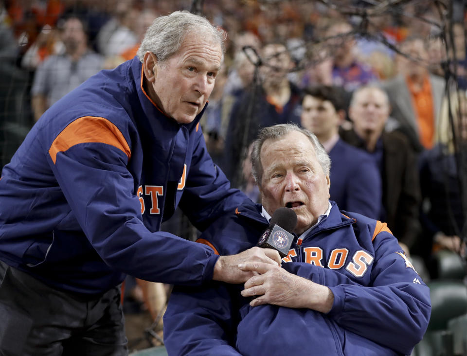 Former Presidents George H.W. Bush and George W. Bush make the play ball announcement before Game 5 of baseball’s World Series against the Los Angeles Dodgers Sunday, Oct. 29, 2017, in Houston. (AP Photo/David J. Phillip)