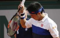 Kei Nishikori of Japan reacts during his men's quarter-final match against Jo-Wilfried Tsonga of France during the French Open tennis tournament at the Roland Garros stadium in Paris, France, June 2, 2015. REUTERS/Pascal Rossignol - RTR4YJP7