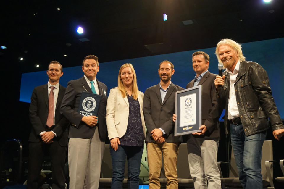 Virgin Galactic and The Spaceship Co. are presented with the Guinness World Record for the most powerful hybrid rocket to be used for crewed spaceflight. <cite>Chelsea Gohd/Space.com</cite>