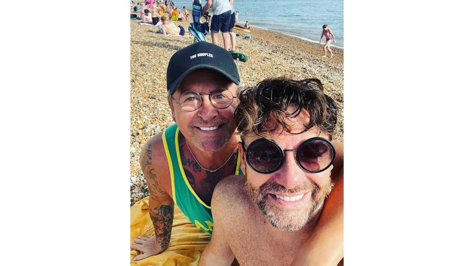 Stephen and Daniel take selfie on the beach