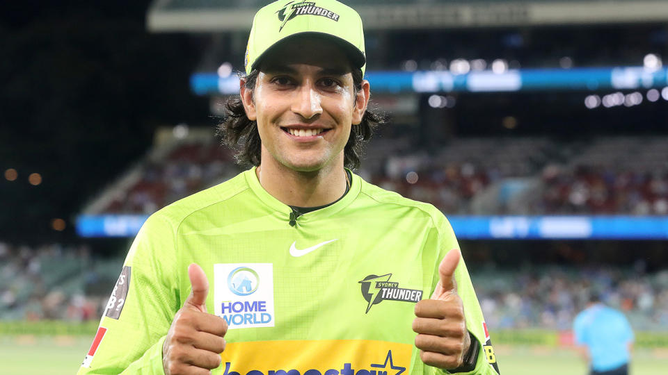 Jason Sangha, pictured here after being named man of the match in the Sydney Thunder's win over Adelaide Strikers.