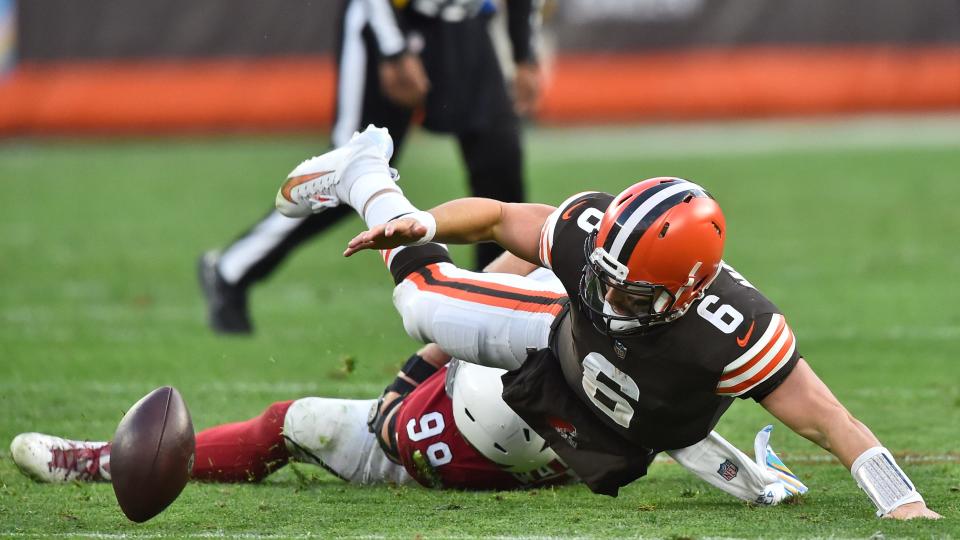 Browns quarterback Baker Mayfield fumbles and is injured on a play during the second half against the Arizona Cardinals, Sunday, Oct. 17, 2021, in Cleveland. (AP Photo/David Richard)