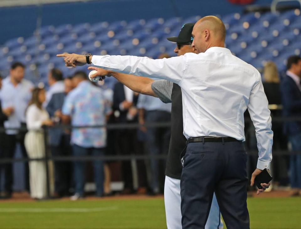 Miami Marlins manager Don Mattingly and Marlins CEO Derek Jeter talk during workout day ahead of Opening Day at the Marlins Park on Wednesday, March 27, 2019 in Miami.