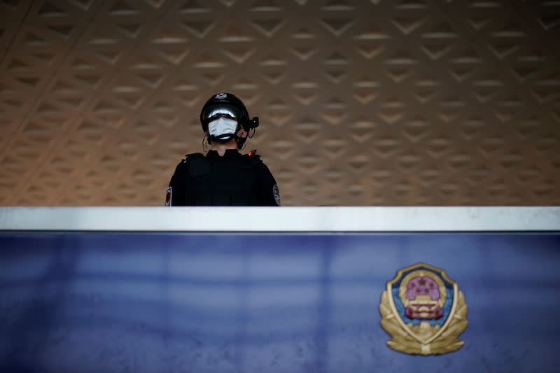 Police officer wearing a face mask is seen at the Wuhan Tianhe International Airport