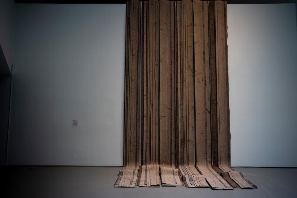 A view of Hera Buyuktasciyan’s work of art “Like an Avalanche Started by a Gental Push” using carpets and metal screws inspired by a childhood photograph of Zaha Hadid.