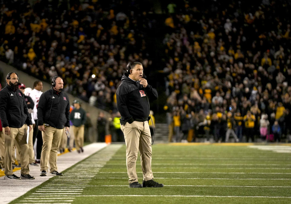 Rutgers head football coach Greg Schiano, center, looks over the field during the second half of an NCAA college football game against Iowa, Saturday, Nov. 11, 2023, in Iowa City, Iowa. (AP Photo/Bryon Houlgrave)