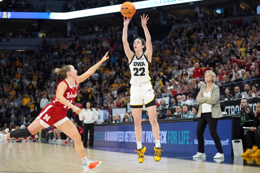Iowa guard Caitlin Clark (22) shoots over Nebraska guard Callin Hake during overtime of an NCAA college basketball game in the final of the Big Ten women’s tournament Sunday, March 10, 2024, in Minneapolis. (AP Photo/Abbie Parr)