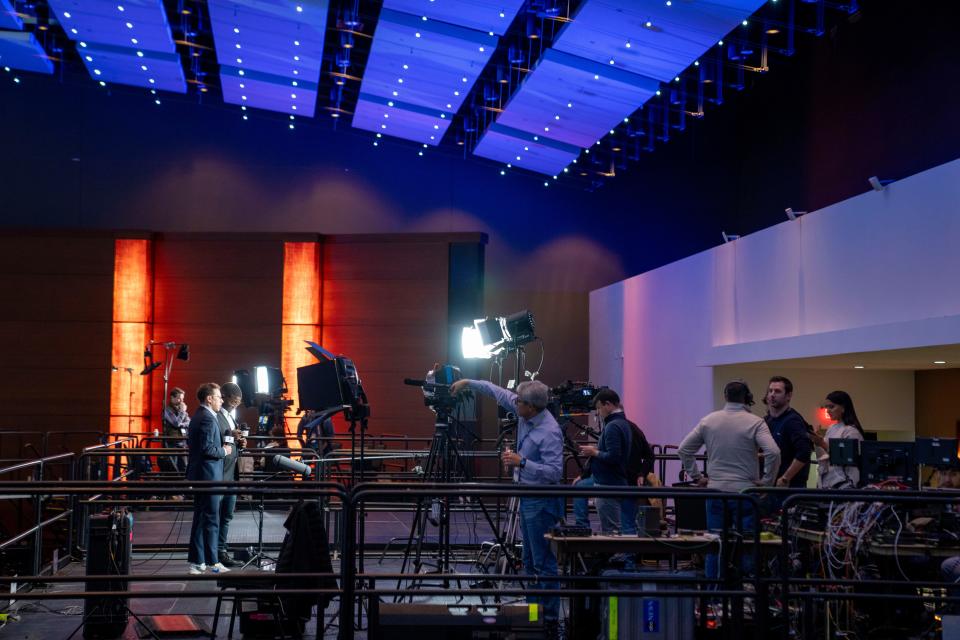 Galen Druke and Alex Presha of ABC News prepare for a standup at the media filing center in the Iowa Events Center, Friday, Jan. 12, 2024.