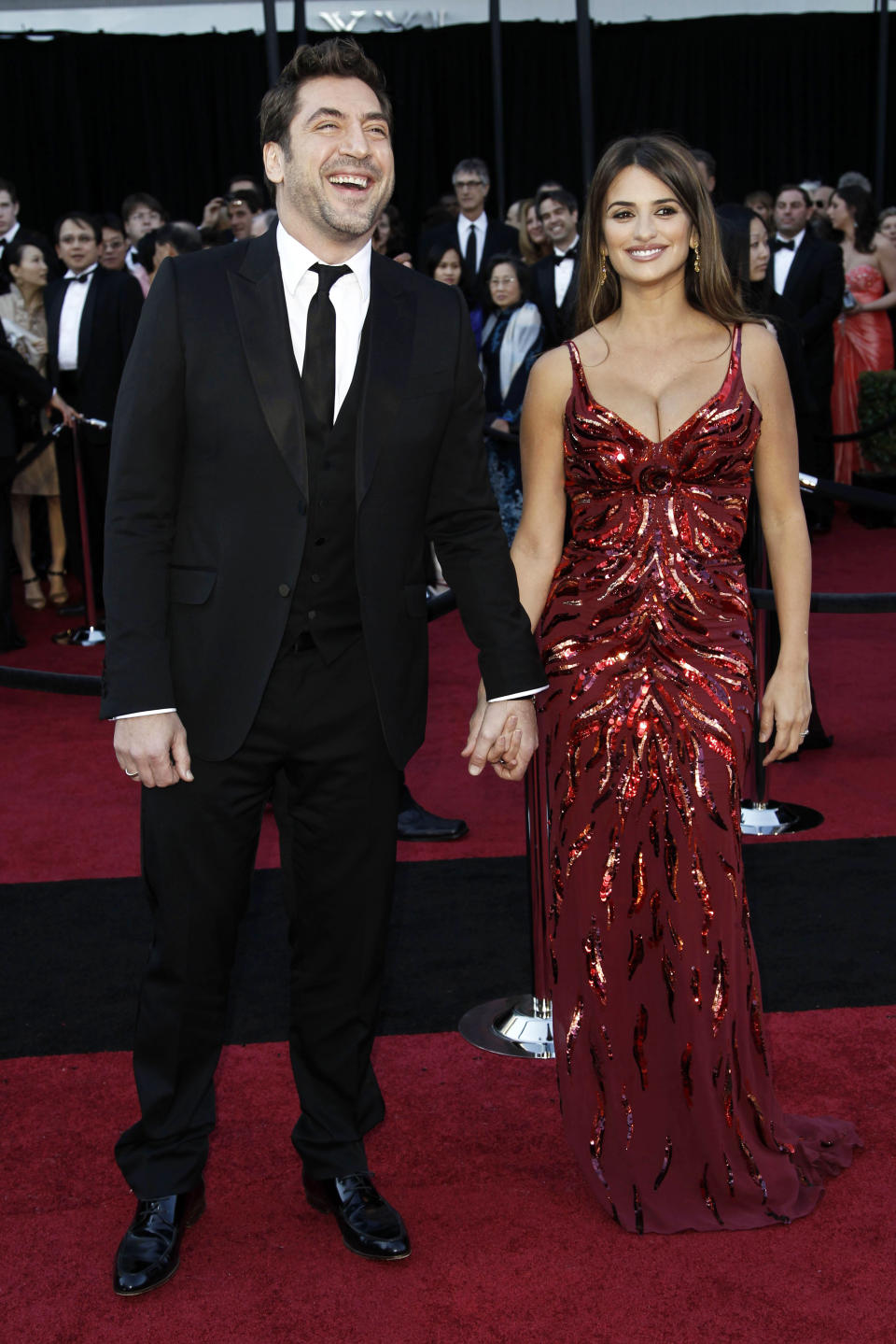 FILE - This Feb. 27, 2011 file photo shows actor Javier Bardem, left, and Penelope Cruz in a L'Wren Scott gown at the 83rd Academy Awards in the Hollywood section of Los Angeles. Scott was found dead Monday, March 17, 2014, in Manhattan of a possible suicide. (AP Photo/Matt Sayles, File)