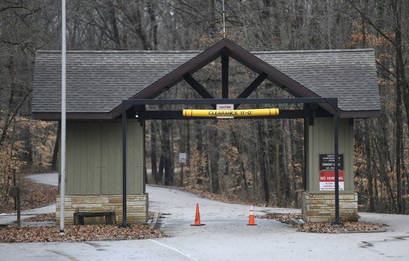 People participating in the night hike at Hardin Ridge Recreation Area on Friday are meeting at the entrance gate.