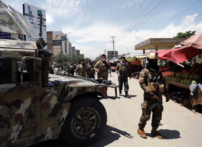 Afghan security forces arrive at the site of an attack in Kabul