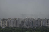 Debris is seen after twin high-rise apartment towers are leveled to the ground in a controlled demolition in Noida, outskirts of New Delhi, India, Sunday, Aug. 28, 2022. The demolition was done after the country's top court declared them illegal for violating building norms. The 32-story and 29-story towers, constructed by a private builder were yet to be occupied and became India's tallest structures to be razed to the ground. (AP Photo/Altaf Qadri)