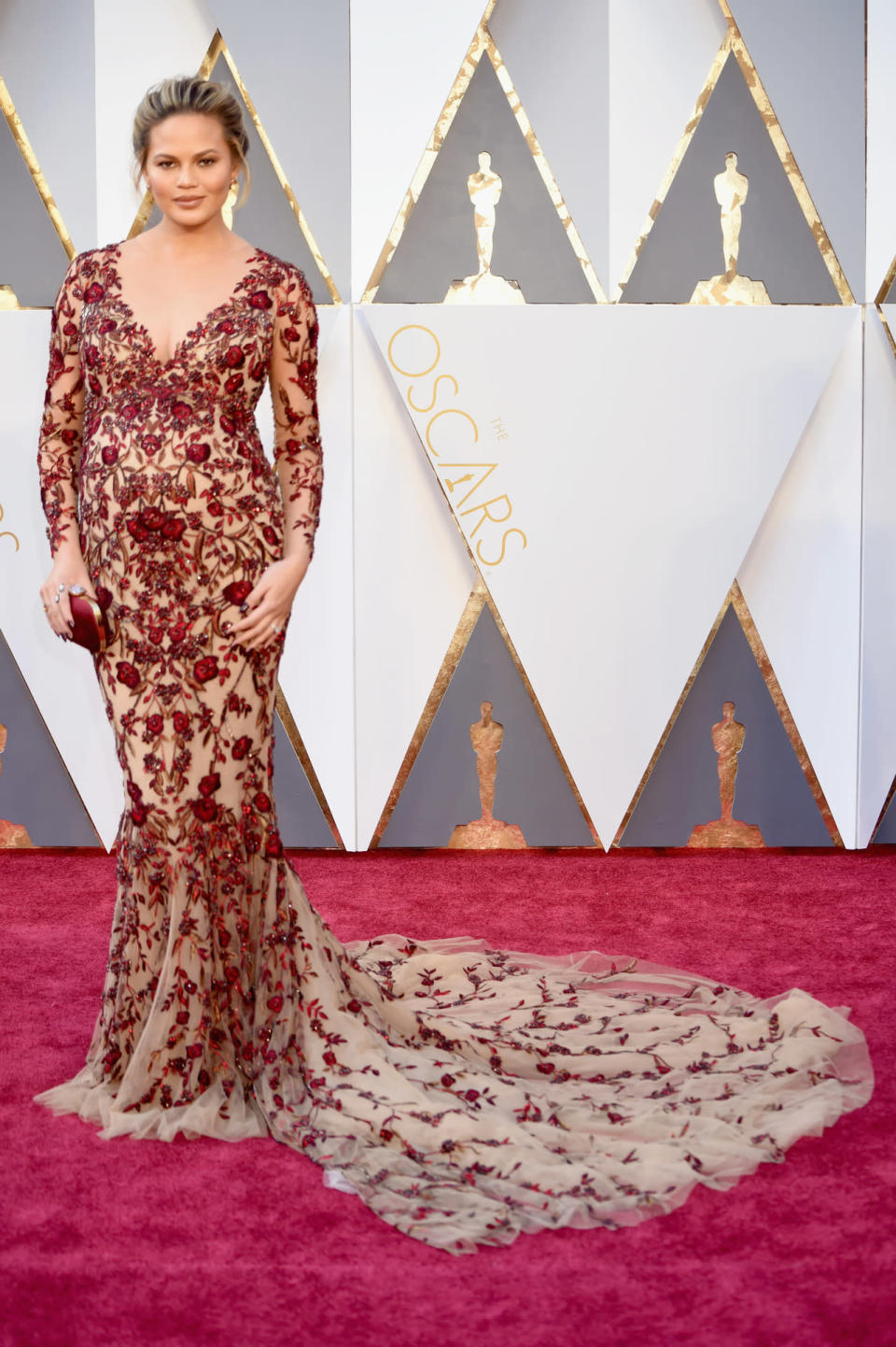<p>Pregnant Chrissy Teigen wore a Marchesa naked dress to the Oscars, where her husband, John Legend, presented an award with collaborator Common. <i><i>(Photo: Getty Images)</i></i></p>
