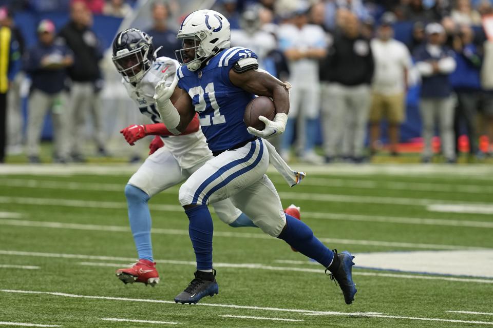 Indianapolis Colts running back Zack Moss, right, runs for a 56-yard touchdown past Tennessee Titans safety Kevin Byard (31) during the first half of an NFL football game, Sunday, Oct. 8, 2023, in Indianapolis. | Darron Cummings, Associated Press