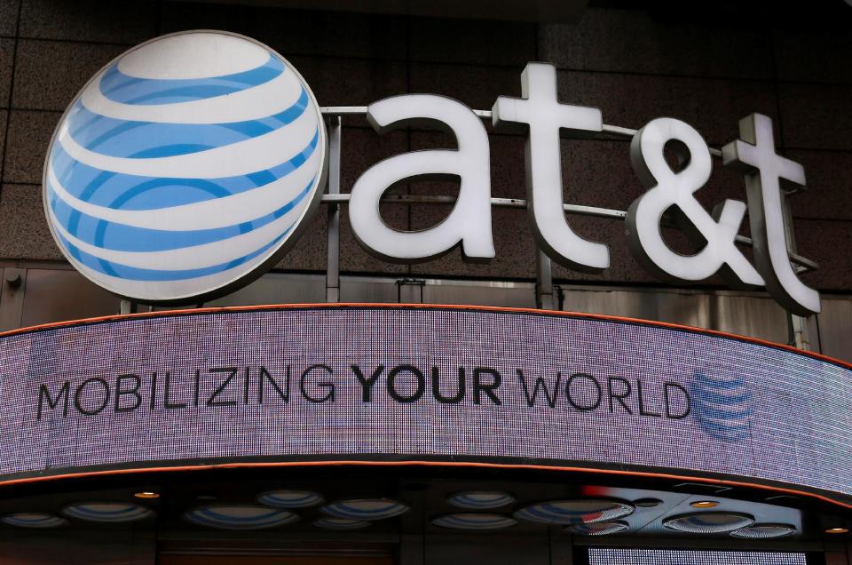 Signage for an AT&T store is seen in New York October 29, 2014. REUTERS/Shannon Stapleton/File Photo