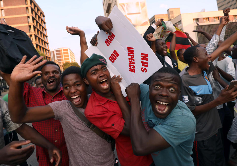 <p>Zimbabweans celebrate after President Robert Mugabe resigns in Harare, Zimbabwe, Nov. 21, 2017. (Photo: Mike Hutchings/Reuters) </p>