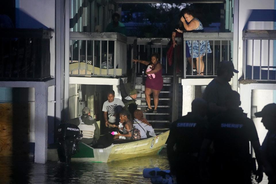 Residents are rescued from an their second story apartment complex in Clearwater (AFP/Getty)