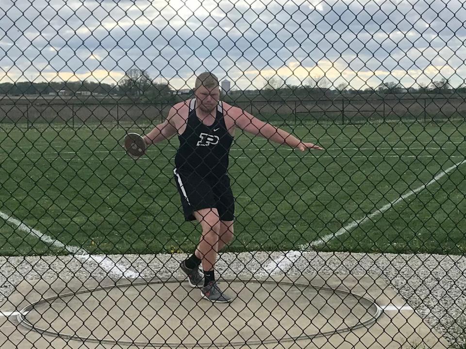 Ethan Enders, shown competing in the discus while a student at Pleasant, is now a starting offensive lineman on the football team at Ashland.