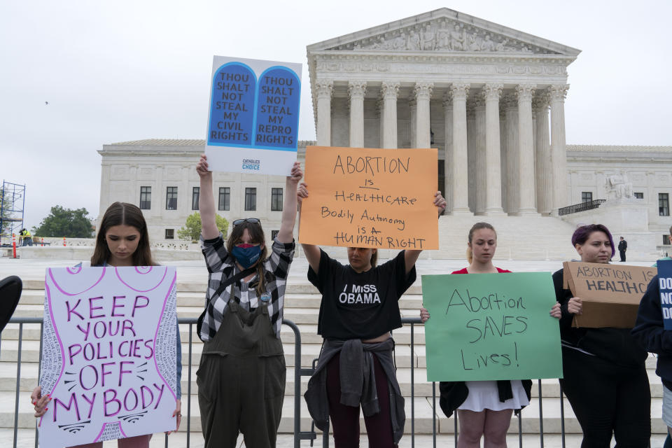 Demonstrators protest outside of the U.S. Supreme Court Tuesday, May 3, 2022 in Washington. A draft opinion suggests the U.S. Supreme Court could be poised to overturn the landmark 1973 Roe v. Wade case that legalized abortion nationwide, according to a Politico report released Monday. Whatever the outcome, the Politico report represents an extremely rare breach of the court's secretive deliberation process, and on a case of surpassing importance. (AP Photo/Jose Luis Magana)