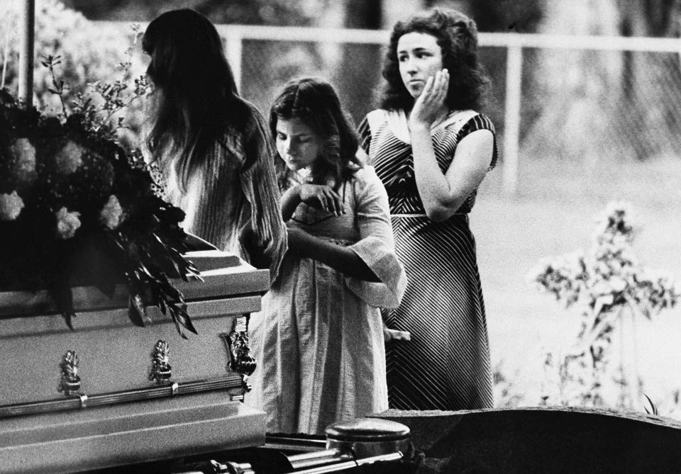 FILE - In this April 13, 1978 file photo, mourners say goodbye to Kimberly Leach at the funeral for the 12-year-old girl in Lake City, Fla. She disappeared Feb. 9, 1978, and was sexually abused and killed by Ted Bundy. Her body was two months later. (AP Photo)