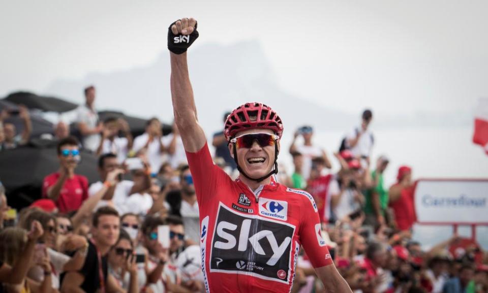 Chris Froome celebrates as he crosses the finish line to win the ninth stage of the Vuelta a España.