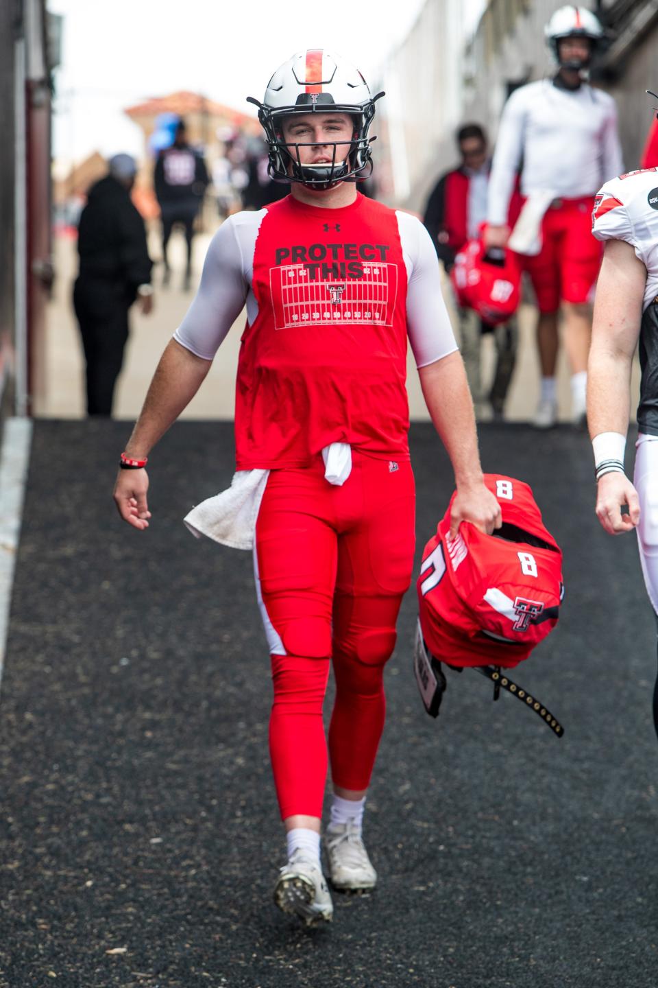 Texas Tech quarterback Maverick McIvor comes down the ramp at the southwest corner of Jones AT&T Stadium. During the 2023 season, both the Red Raiders and their opponents will enter and exit the field via the southeast corner ramp, Tech athletics officials said, because of the ongoing construction project at the south end of the stadium. Tech visitors will dress in trailers in the stadium's east parking lot.