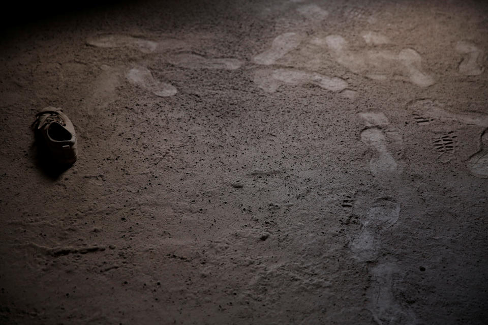 <p>A shoe covered with ash lies inside a house affected by the eruption of the Fuego volcano at San Miguel Los Lotes in Escuintla, Guatemala, June 7, 2018. (Photo: Carlos Jasso/Reuters) </p>