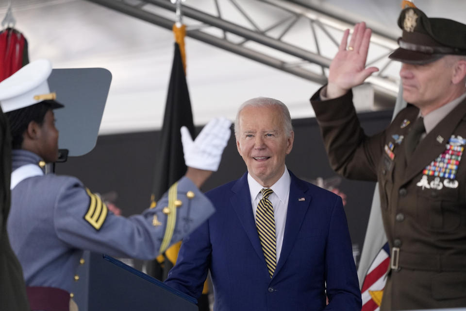 President Joe Biden, center, looks on as Lt. General Steven W. Gilland, Superintendent of the U.S. Military Academy, right, congratulates graduating cadet Stevie Gary, left, after Gary is presented as the class "goat," or lowest-ranking class member, at the U.S. Military Academy commencement ceremony, Saturday, May 25, 2024, in West Point, N.Y. (AP Photo/Alex Brandon)