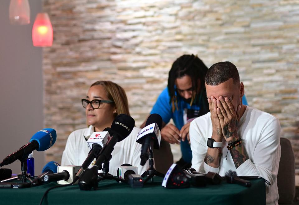 Mother Keila Ortiz, left, and father Jose Antonio Rodriguez, right, offer a press conference at the wake of their daughter Keishla RodriguezAP