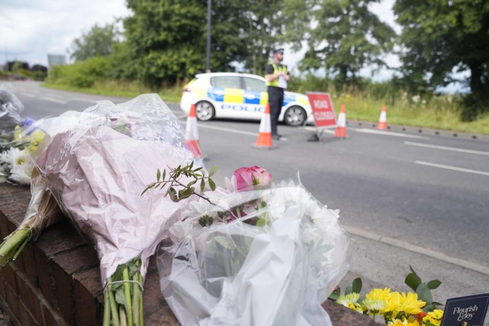 Flowers and tributes laid near the platform on the A61 in Wakefield (PA Wire)