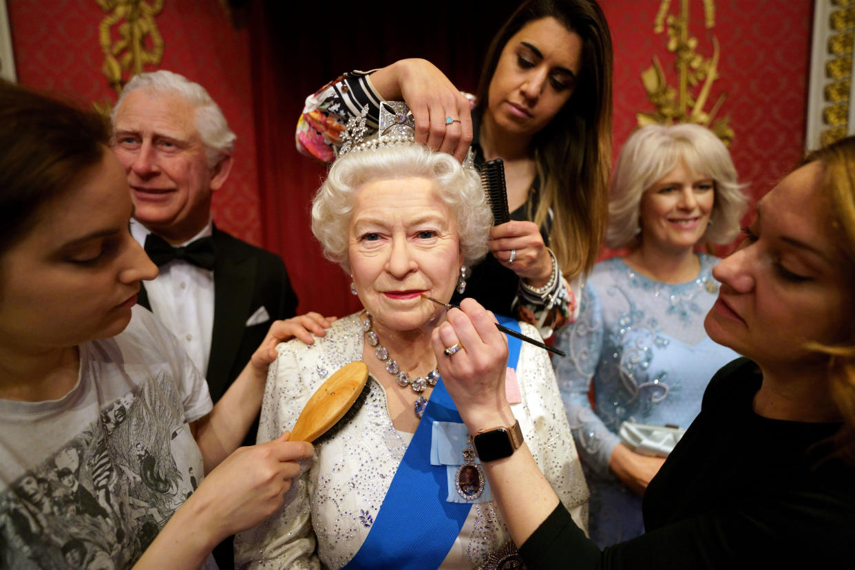 Studio artists Luisa Compobassi (left), Caryn Mitanni (back) and Jo Kinsey (right) make their final touches to the wax figure of Queen Elizabeth II at Madame Tussauds London ahead the Platinum Jubilee celebrations. Picture date: Wednesday May 25, 2022. (Photo by Victoria Jones/PA Images via Getty Images)