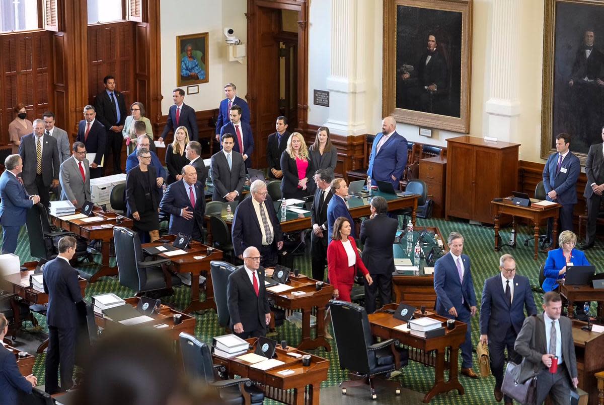 Senators file into the Senate floor at the beginning of the impeachment trial of suspended Attorney General Ken Paxton on Sept. 5, 2023.
